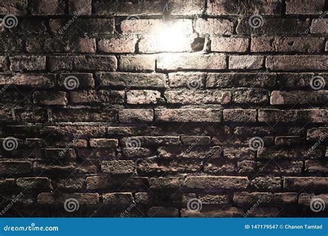 Grungy Dark Red Brick Wall With Spotlight Texture Background Stock