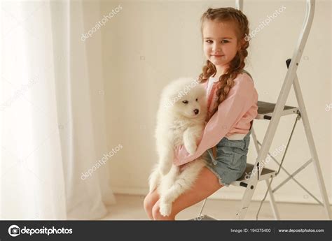 Girl Cute Puppy Ladder Posing Studio Stock Photo By ©batkovaelena 194375400