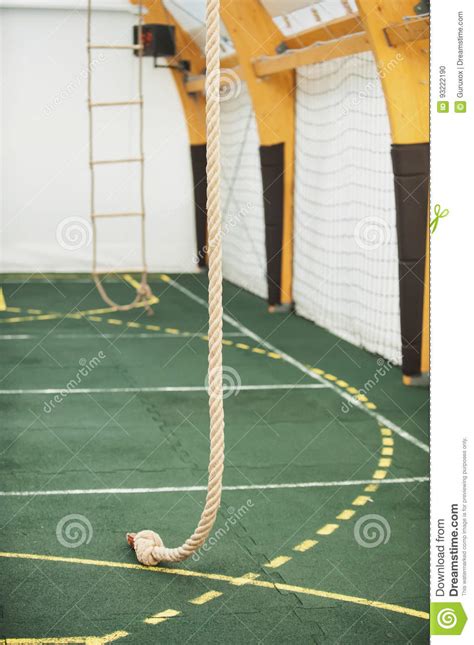 Rope For Climbing In Sport School Gym Hall Stock Photo