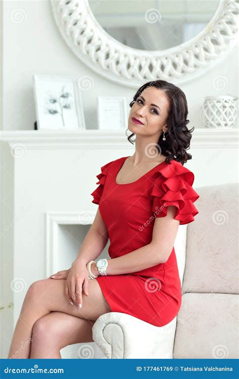 Portrait Of Elegant Young Sophisticated Woman Brunette In A Short Red