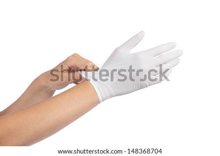Woman Hands Putting On Latex Gloves Stock Photo Edit Now