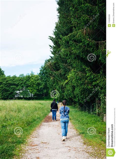 Mother And Daughter Walk Along The Path Stock Image Image Of Path