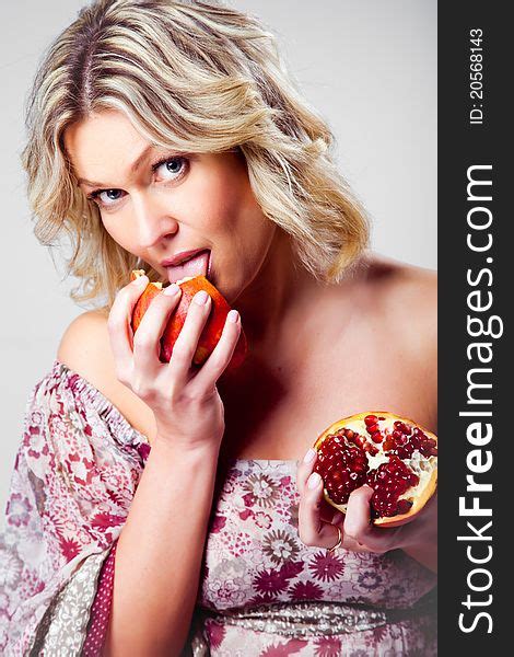 Blonde Woman Licking Pomegranate Grey Free Stock Photos Stockfreeimages
