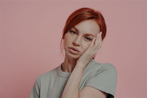 Unhappy Tired Exhausted Ginger Woman Touching Face With Hand Suffering