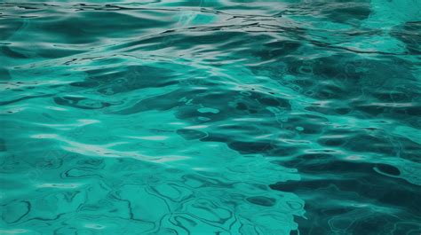 Turquoise Water With Ripples Going From One Side To Another Background