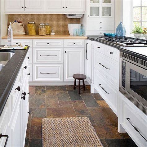 Gray flooring can be made from a variety of materials including tile, stone, and wood laminate. Found on Bing from www.pinterest.com | Slate floor kitchen ...