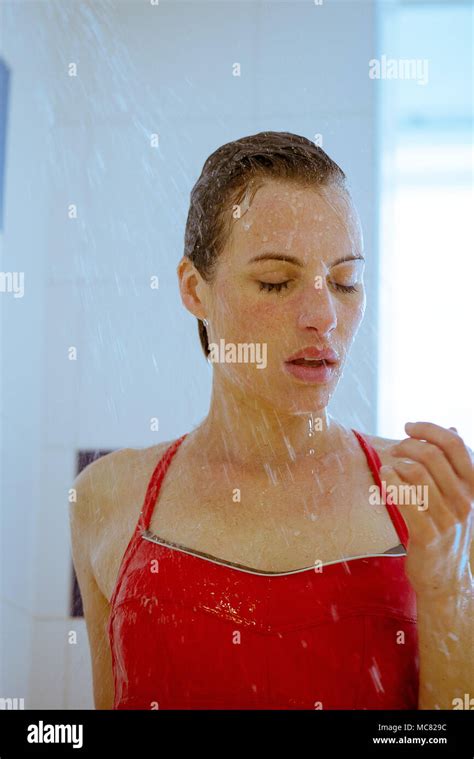 Woman Showering In Swimsuit Stock Photo Alamy