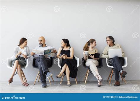 Group Of People Sitting On Chairs Stock Photo Image Of People Candid