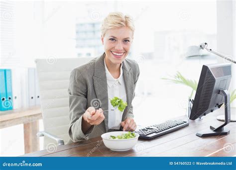 Businesswoman Eating Salad On Her Desk Stock Photo Image Of Corporate
