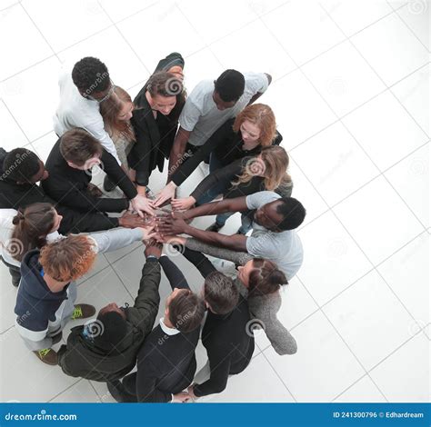 Group Of Young Successful People Stands Around Hands Together Stock