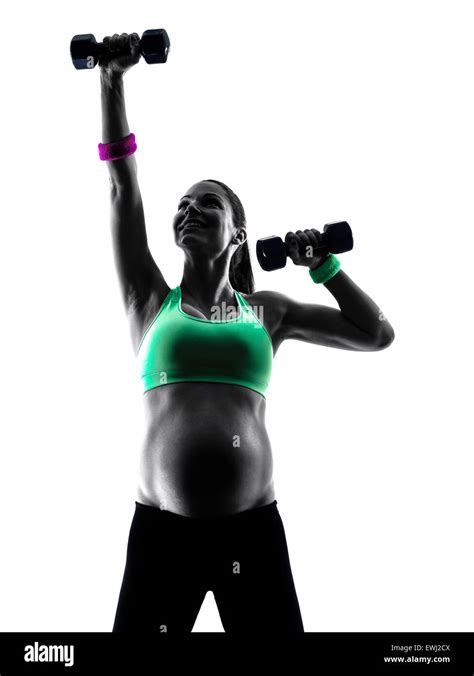 One Caucasian Pregnant Woman Exercising Fitness Exercises In Silhouette