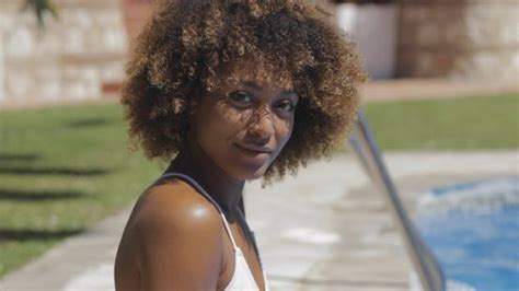 black woman on poolside stock video envato elements