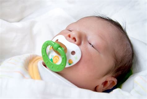 Newborn Baby With Pacifier Sleeping Stock Photo Image Of Candid