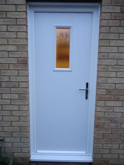 A Composite Back Door In White Installed By Cove Windows Simple And