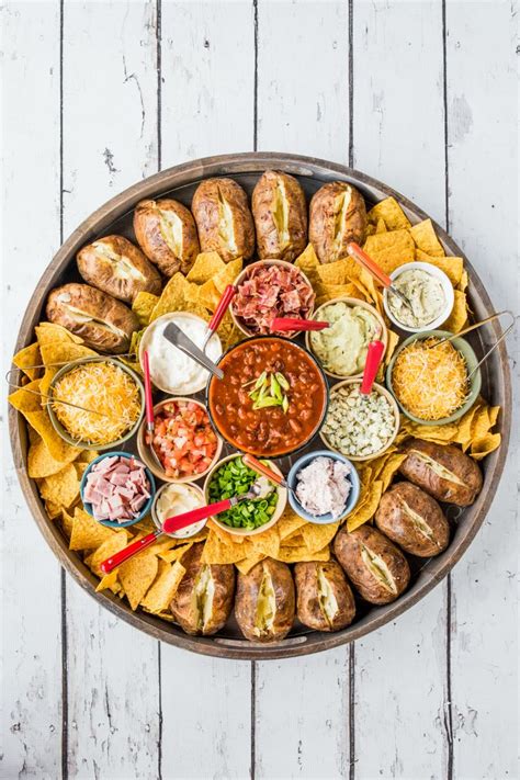 The second puts hummus, tapenade, nuts and crudités front and center for 8. Baked Potato Dinner Board #bakedpotatoes # ...