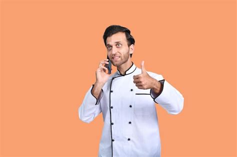 Premium Photo Handsome Chef Talking On Phone White Outfit Indian Pakistani Model