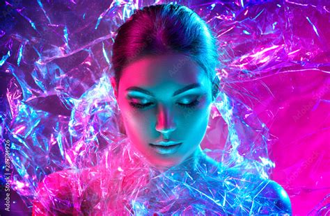 Fashion Model Woman In Colorful Bright Neon Lights Posing In Studio