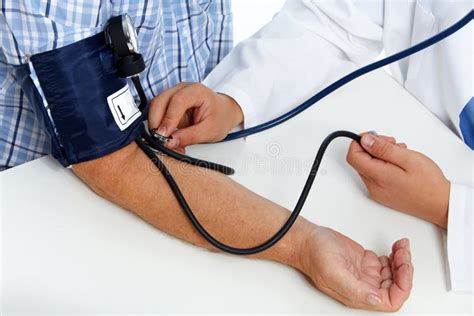 Doctor Checking Patient Blood Pressure Stock Image Image Of Clinic