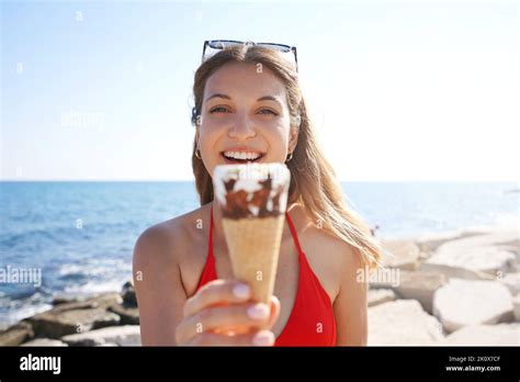 Happy Young Tourist With Camera And Ice Cream Cone Hi Res Stock