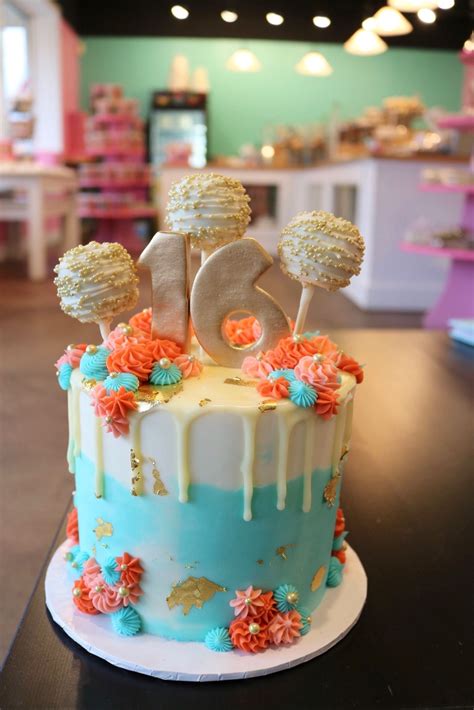 Find images of birthday cake. Blue and Coral cake with rosettes and gold foil. The cake ...