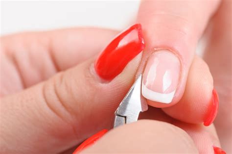 Premium Photo Cuticles Cutting With Nail Clippers