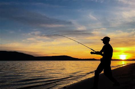 Young Man Fishing At Sunset Stock Image Image Of Angler Late 100114461