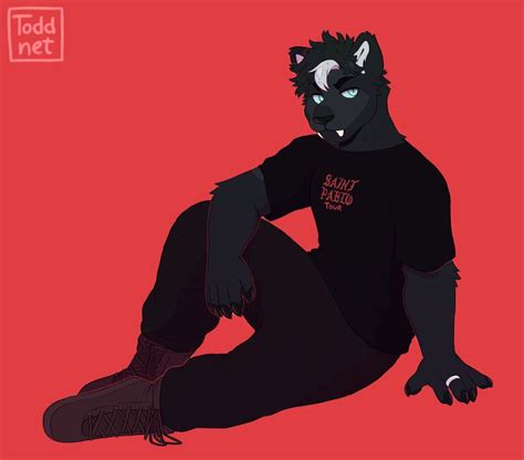 A Black Cat Sitting On Top Of A Red Floor