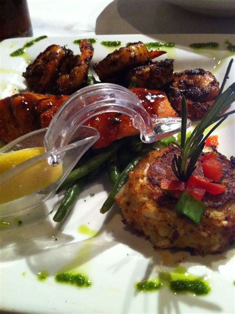 Capers Restaurant BBQ salmon, crab cakes and spicy grilled shrimp