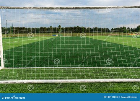 Football Goal On The Field View Of The Goal From Behind Stock Photo