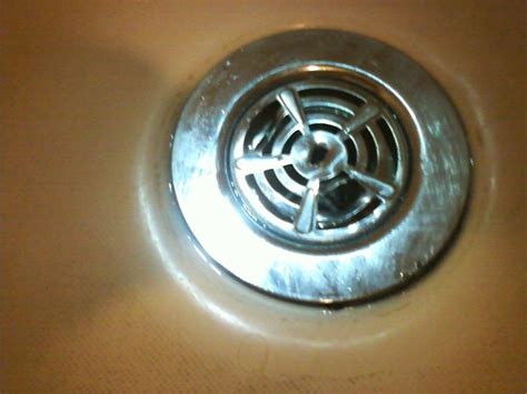 Set the drain to its open position. Shower drain cover removal