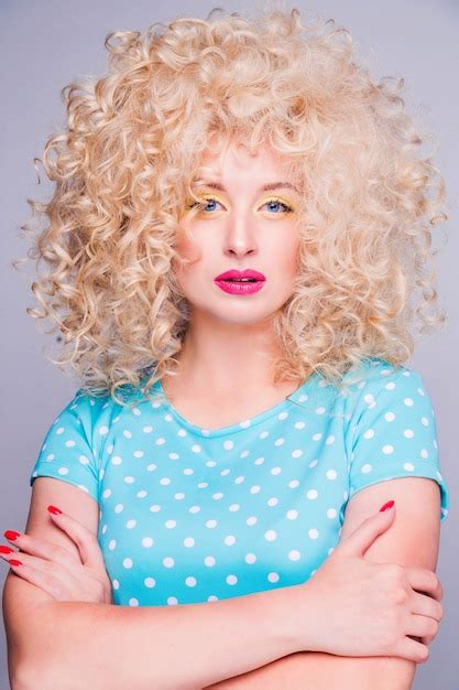 premium photo beautiful fashionable blonde girl in retro style with voluminous curly hairstyle