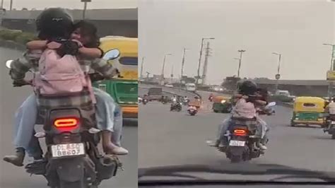 Couples Pda Moment On Bike On Delhi Highway Goes Viral Traffic Police React Watch
