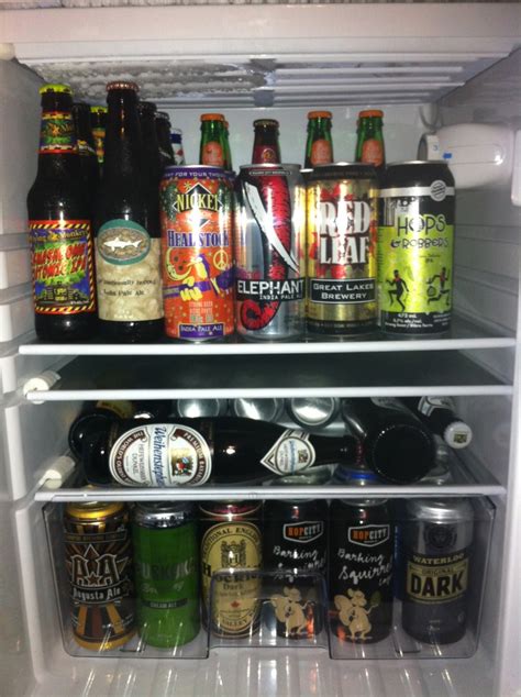 An Open Refrigerator Filled With Lots Of Different Types Of Beer