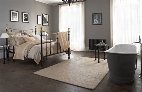 The Ultimate Luxury A Classic Metal Bed And A Roll Top Bath In Your