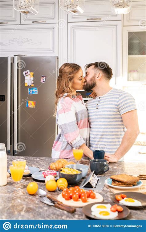 Loving Couple Kissing In Kitchen Stock Photo Image Of Enjoying