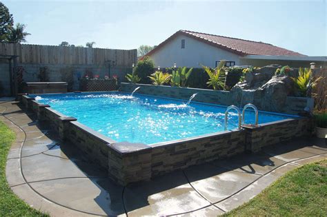 This is my custom homemade 14' water slide going into a 21' above ground pool. This exlusive Islander pool is 14' x 28' with a rock waterfall and 2 cascades. | Diy swimming ...