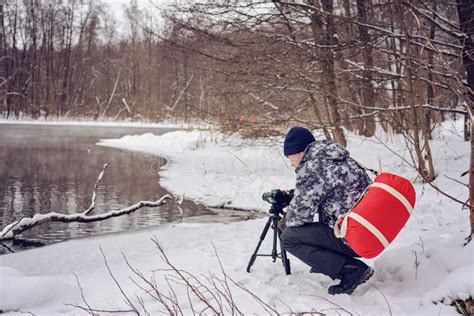 Amateur Photographer Takes A Winter Landscape On The Lake In The Forest Copy Space Stock Image