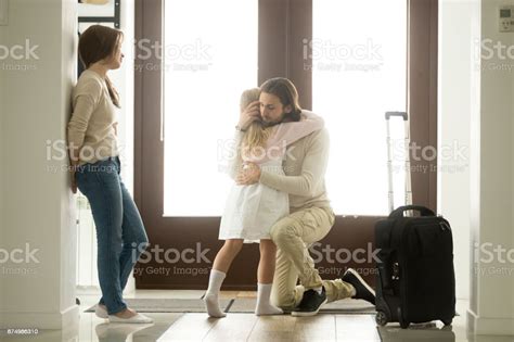 Sad Father Hugging Little Daughter Before Leaving For Long Trip Stock