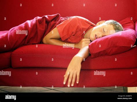 Little Boy Sleeping On The Sofa Stock Photo Alamy
