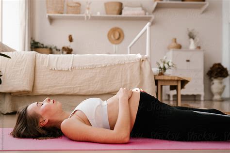 Pregnant Woman Lies On Yoga Mat By Stocksy Contributor Alina