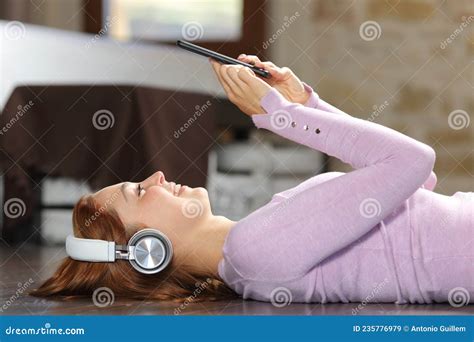 Happy Woman Listening To Music Lying On Bedroom Stock Image Image Of