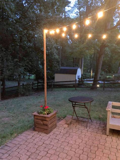 Outdoor lights add style and valuable lighting to your walkways, deck, patio or yard. DIY String Light Poles and Planters — This Homemade Heaven