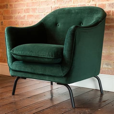 Feet are black ebonized and have spherical shape. Emerald Green Velvet Chair | green chair | Margo & Plum