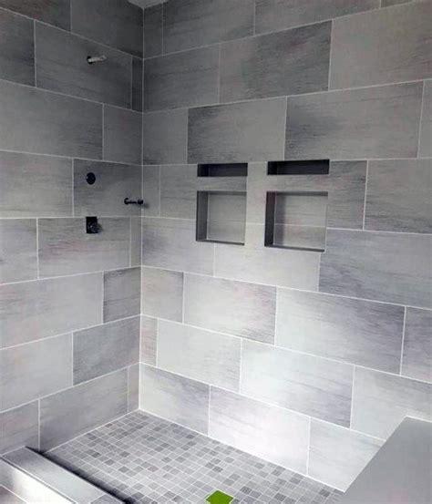 For the ultimate bathroom, tile your shower area with calacatta gold marble slabs with the top of the bench tiled with quartz that's made to look similar to marble. 70 Bathroom Shower Tile Ideas - Luxury Interior Designs