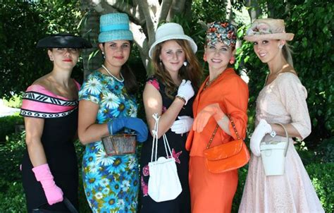 Young Models Dressed In 1960s Attire From The Paris Street