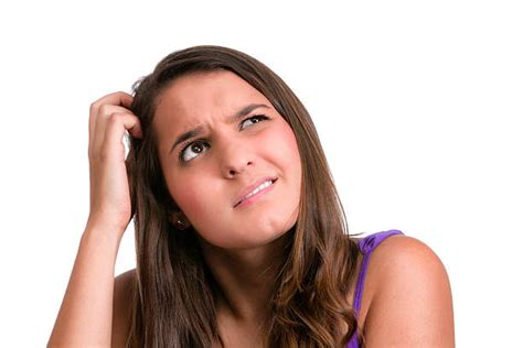 Royalty Free Confused Young Woman Scratches Head Pictures Images And