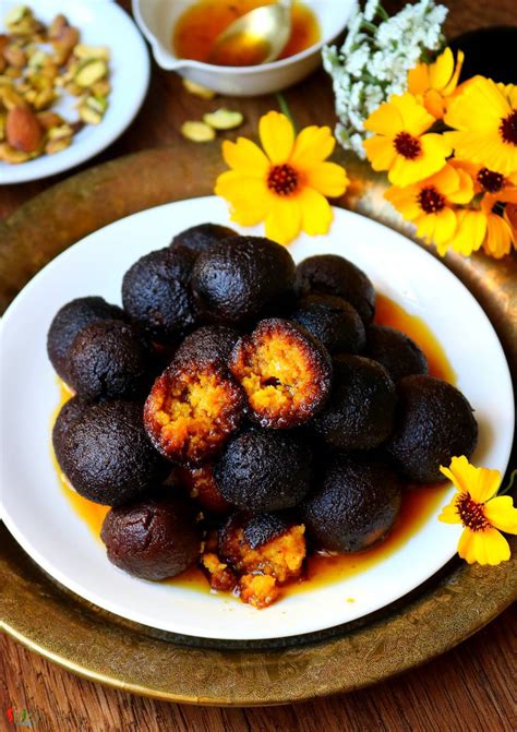 Kala is calm, gentle, kind, and loving. Suji Kala Jamun (Kalo Jaam) - Spicy World Simple and Easy ...