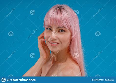Portrait Of Beautiful Young Woman With Pink Hair And Perfect Skin Smiling At Camera Posing