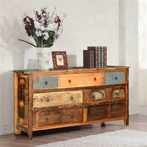 Crafted from solid pine wood, its frame features a slatted design and a weathered finish. Appalachian Rustic Distressed Reclaimed Wood 7 Drawer Dresser