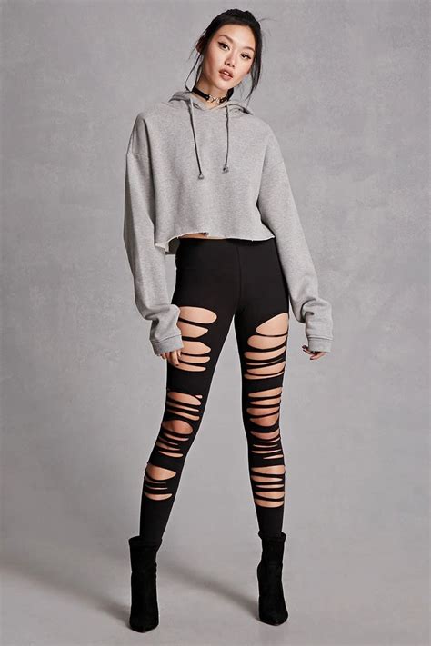 A Pair Of Stretch Knit Leggings Featuring A Ripped Design And An Elasticized Waist This Is An